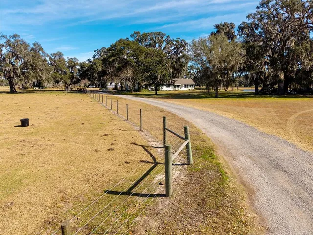 a view of swimming pool with table and chair