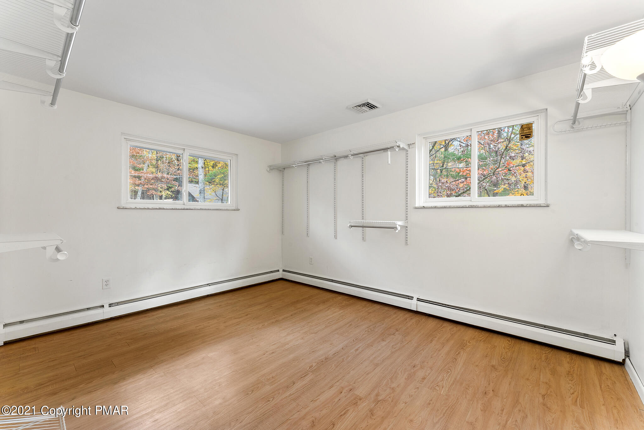 177 Tyrolean Way Henryville, PA 18332 - Photo 12 of 27 a view of a room with wooden floor and window