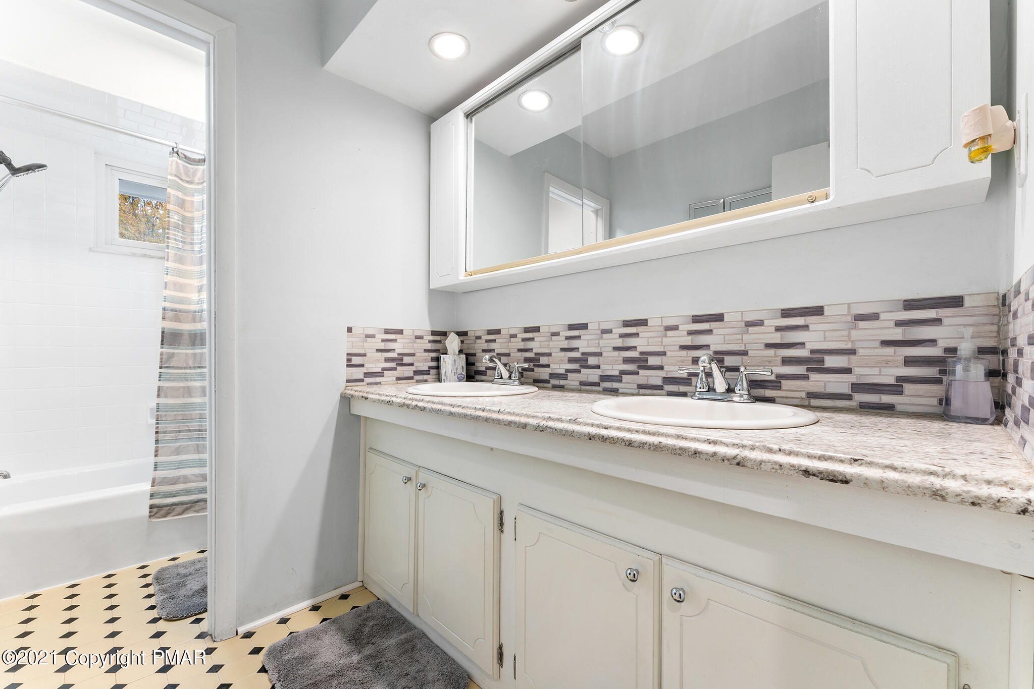 177 Tyrolean Way Henryville, PA 18332 - Photo 14 of 27 a bathroom with a sink and a mirror