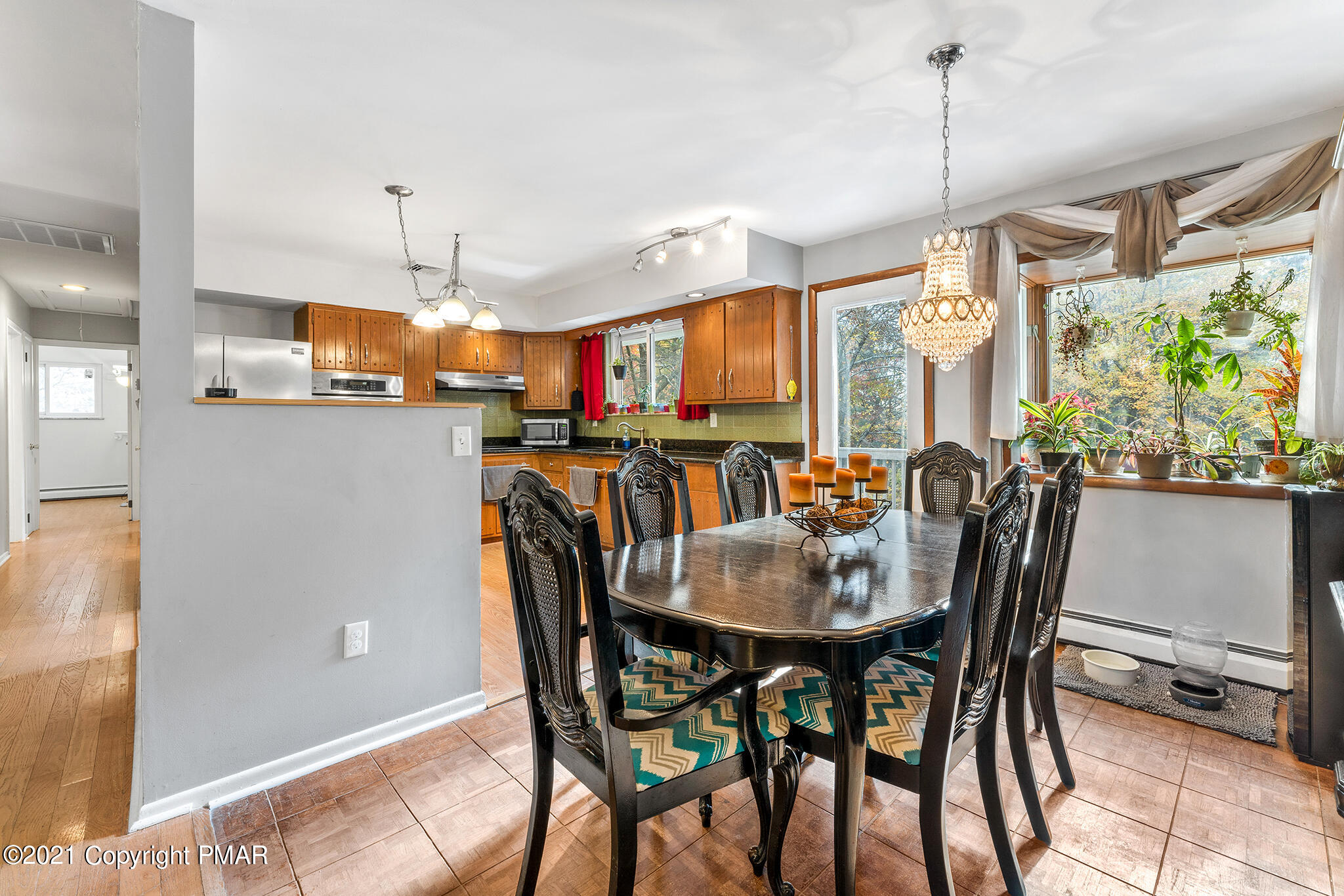 177 Tyrolean Way Henryville, PA 18332 - Photo 6 of 27 a view of a dining room with furniture window and outside view