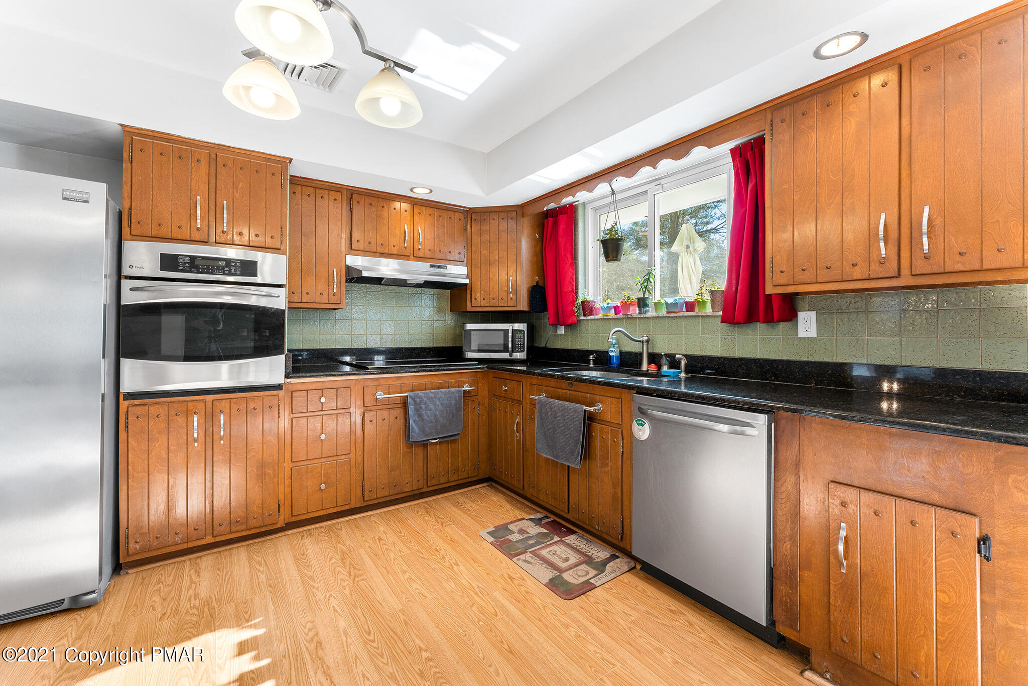 177 Tyrolean Way Henryville, PA 18332 - Photo 8 of 27 a kitchen with stainless steel appliances granite countertop a sink stove and cabinets
