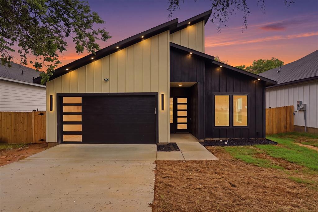 1111 Riverwood Road Dallas, TX 75217 - Photo 1 of 40 Modern architectural exterior with a distinctive angled roofline