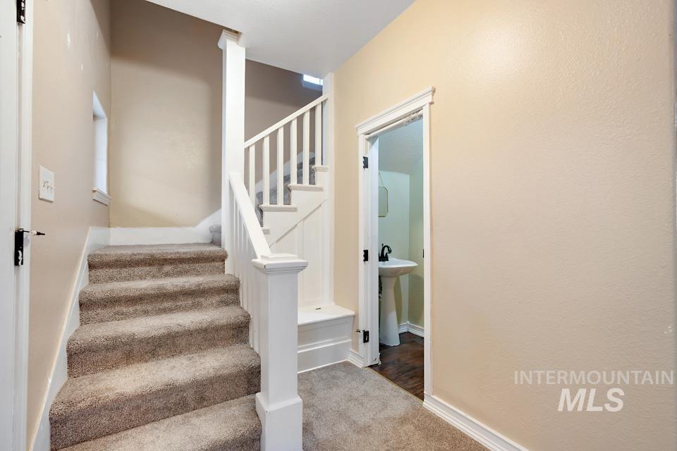 1230 East Main Street Weiser, ID 83672 - Photo 12 of 25 Stairs with carpet and baseboards