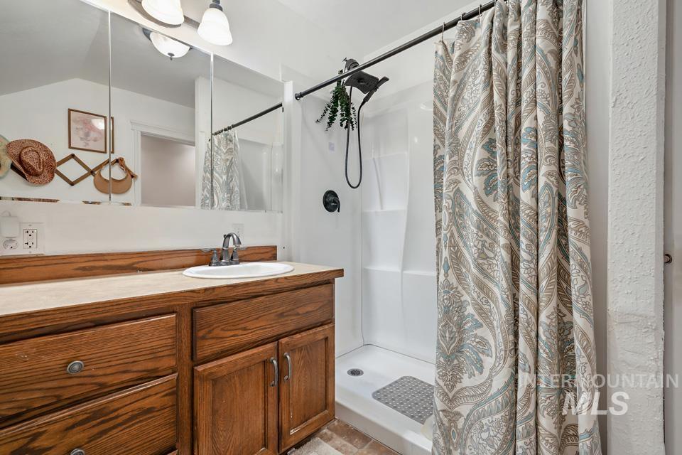 1230 East Main Street Weiser, ID 83672 - Photo 19 of 25 Full bathroom featuring a shower stall and vanity