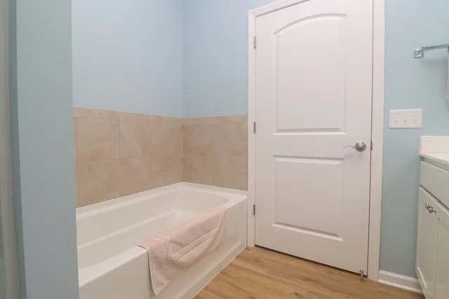 a bathroom with a glass shower door