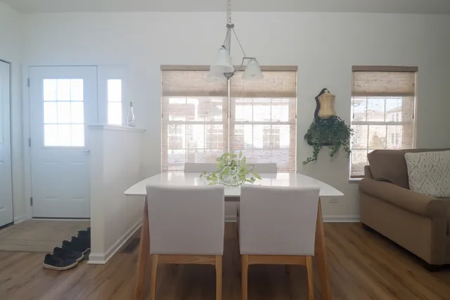 a kitchen with granite countertop a refrigerator stove and microwave