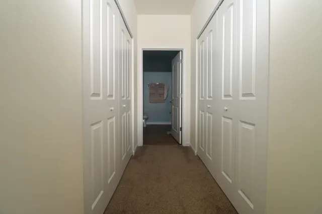 a spacious bathroom with a double vanity sink toilet