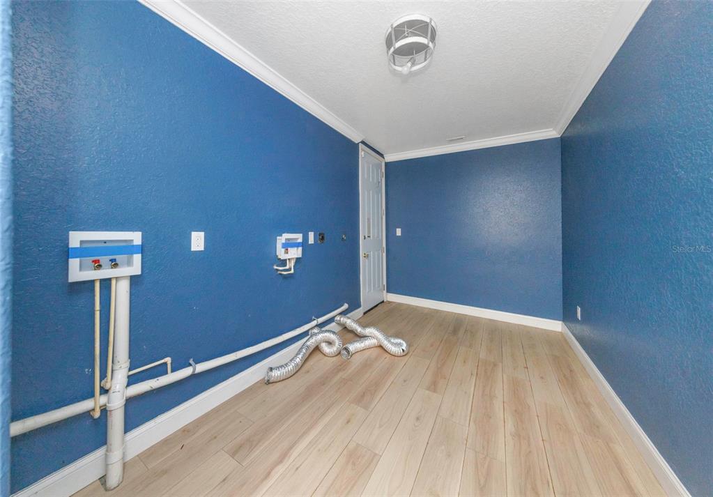 20138 Bowman Road Spring Hill, FL 34610 - Photo 40 of 40 a view of empty room with wooden floor