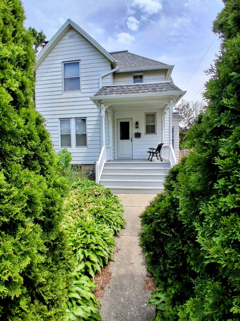 742 South 4th Street DeKalb, IL 60115 - Photo 42 of 46 a view of a house with sitting area and garden