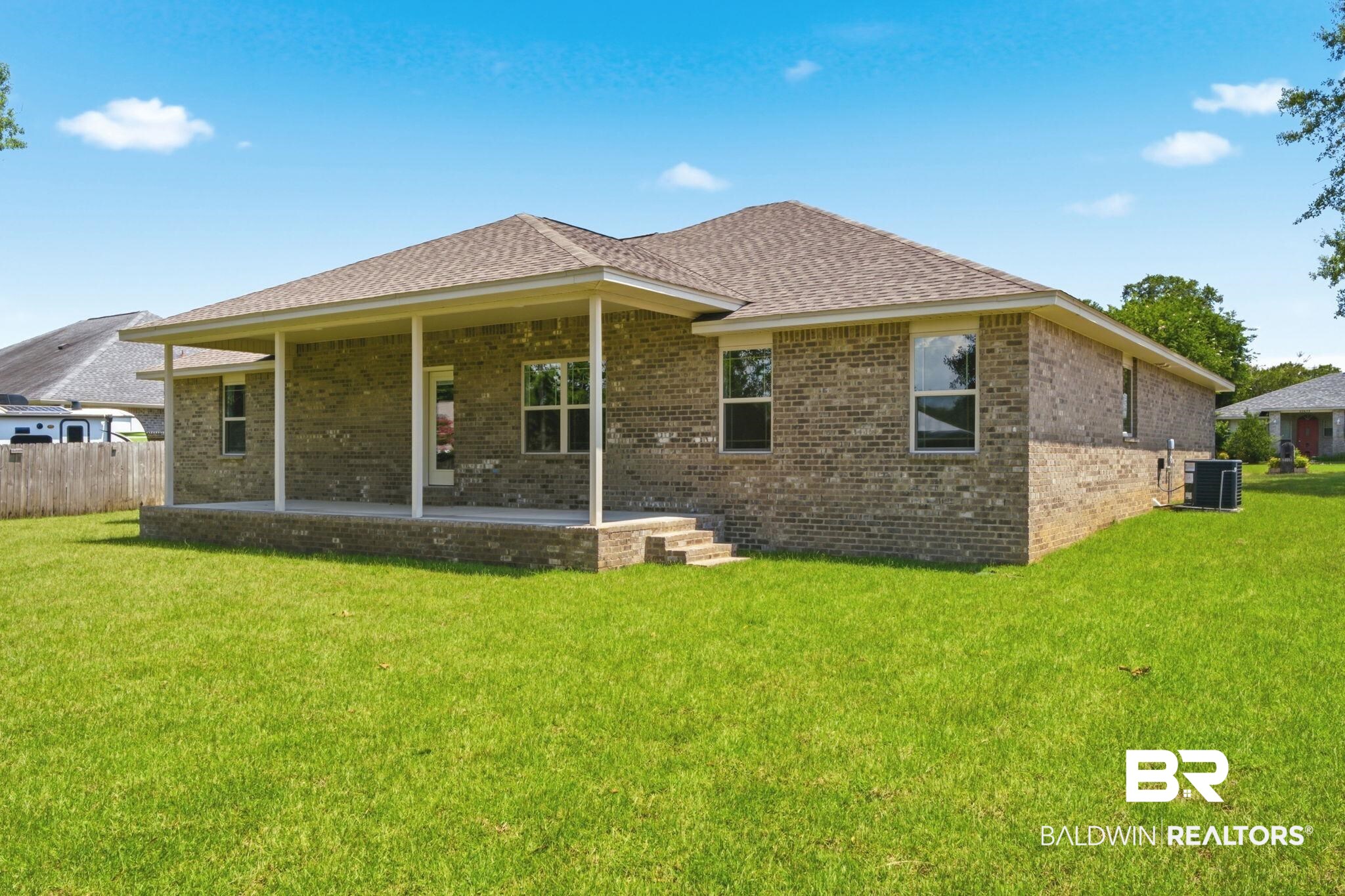 32656 Arbor Ridge Circle Lillian, AL 36549 - Photo 32 of 56 Rear exterior with brick facade and a covered patio