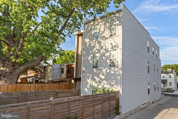 a view of a house with a tree
