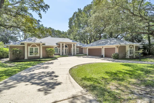 a bathroom with a tub shower sink and mirror