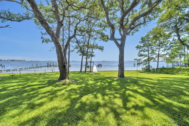 a bedroom with a bed and a chair