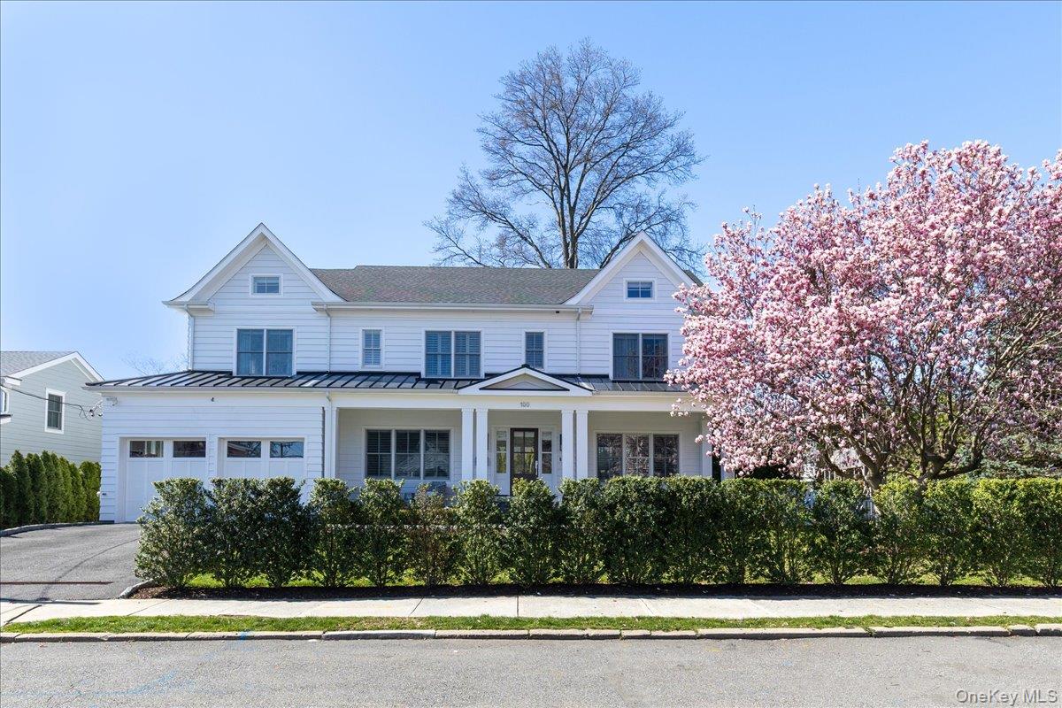 The front of the property features a beautiful cherry tree that is typically in peak bloom end of April.