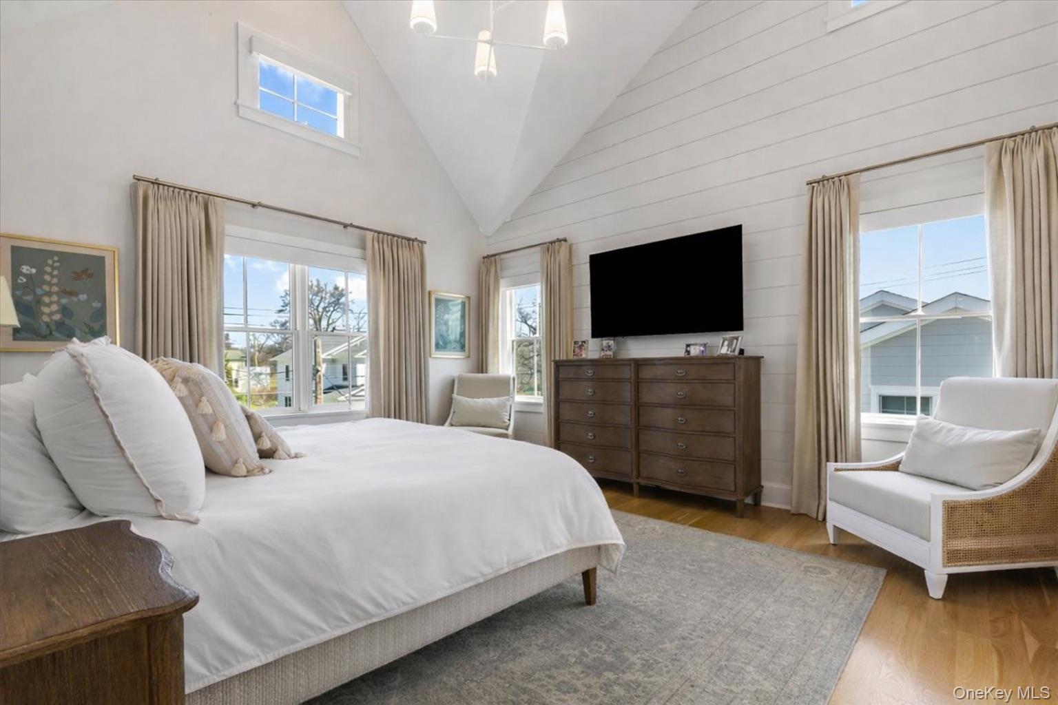 100 Dearborn Avenue Rye, NY 10580 - Photo 16 of 49 The primary bedroom has a cathedral ceiling and seasonal water views.