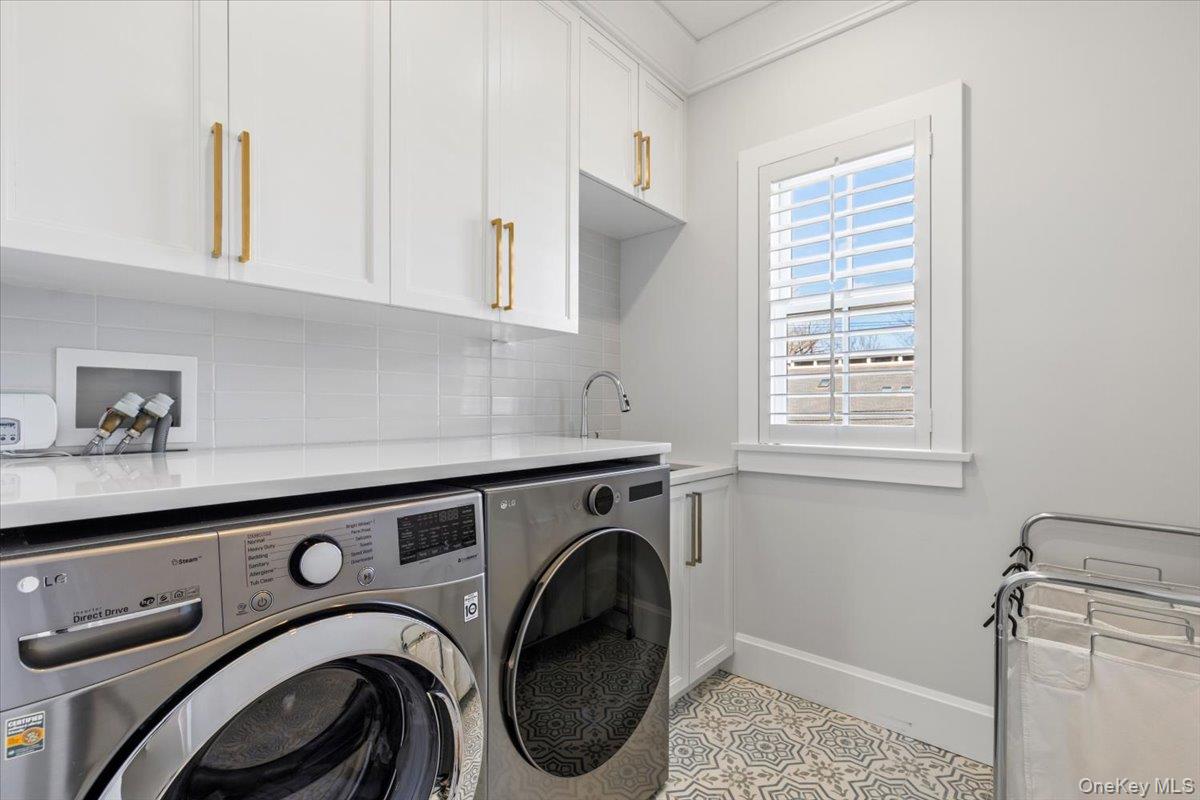 100 Dearborn Avenue Rye, NY 10580 - Photo 28 of 49 Second level laundry room with custom cabinetry and sink.