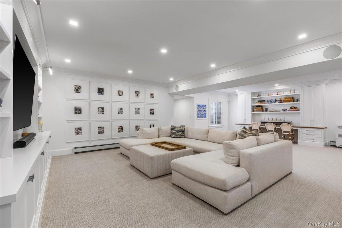 100 Dearborn Avenue Rye, NY 10580 - Photo 30 of 49 Spacious lower level with natural light and custom plantation shutters.