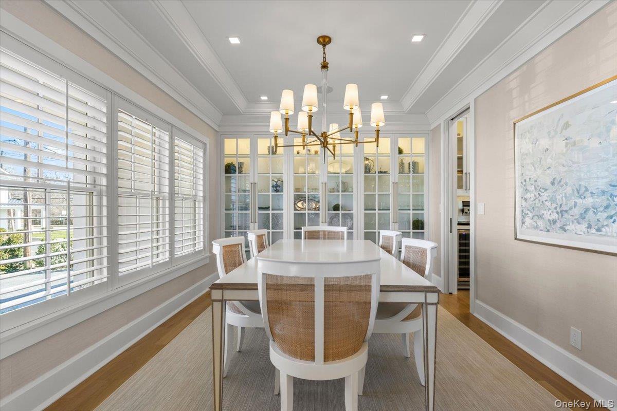 100 Dearborn Avenue Rye, NY 10580 - Photo 5 of 49 The dining room features custom glass front cabinetry and class crown molding.