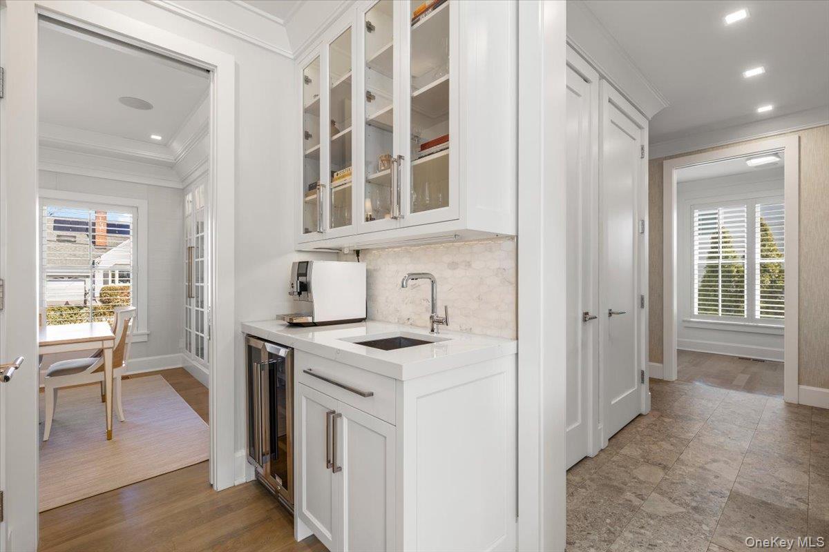 100 Dearborn Avenue Rye, NY 10580 - Photo 6 of 49 The dining room opens onto the butler's pantry with beverage/wine refrigerator, sink, and additional cabinetry.