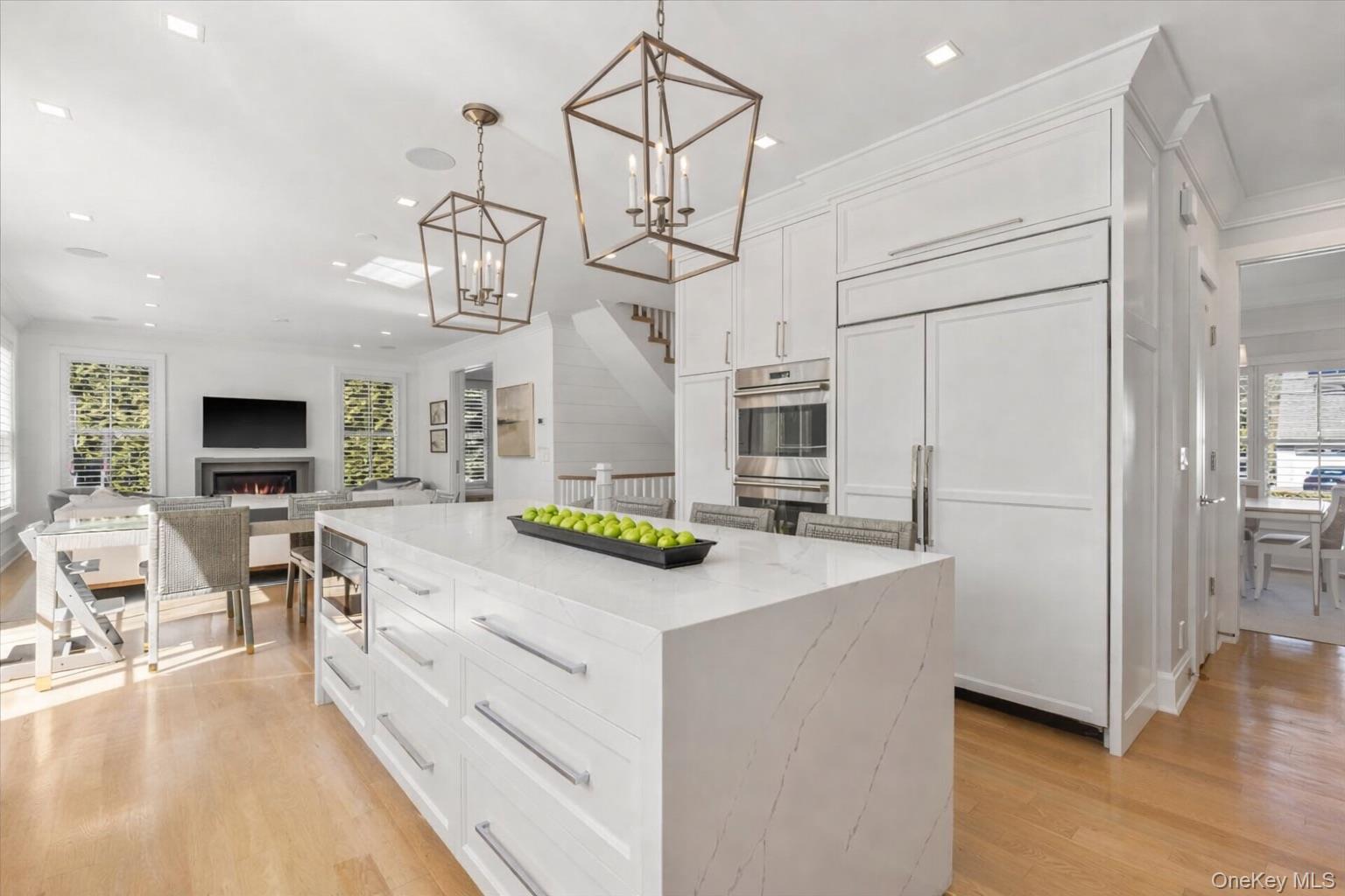 100 Dearborn Avenue Rye, NY 10580 - Photo 7 of 49 The kitchen features a waterfall quartz island with built-in microwave.