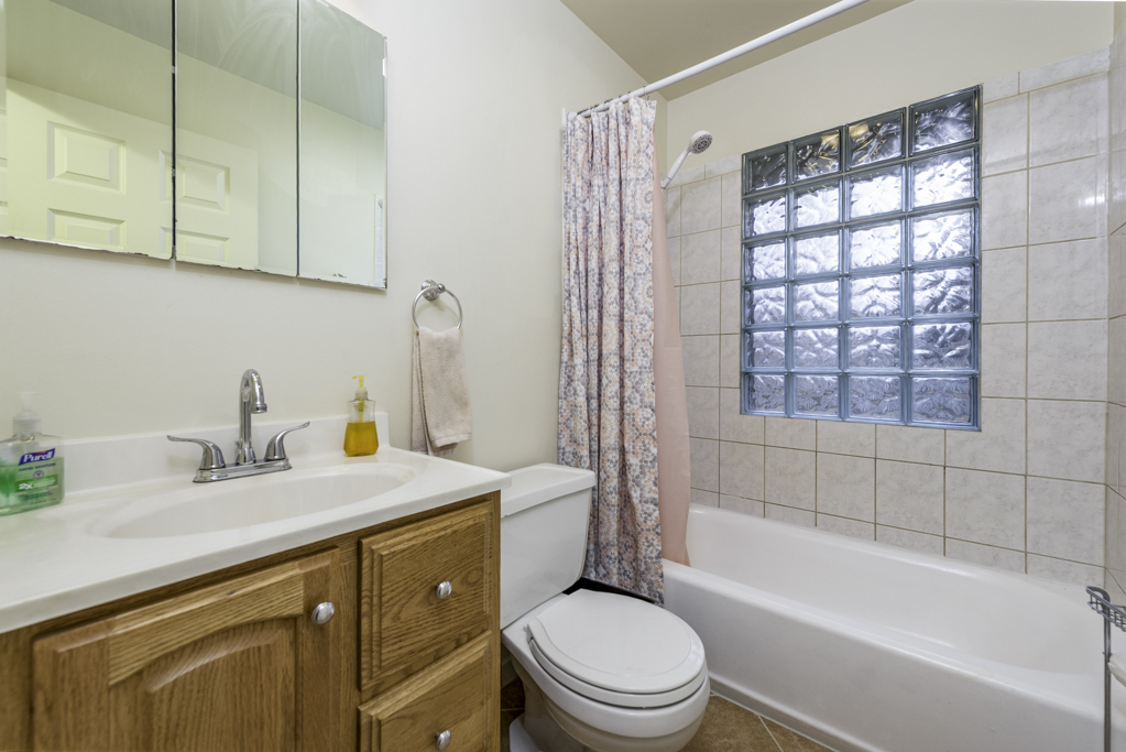 35861 North Fuller Road Gurnee, IL 60031 - Photo 18 of 30 a bathroom with a sink a toilet and shower