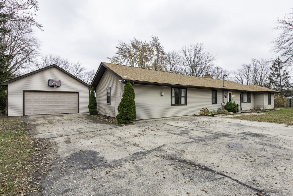 35861 North Fuller Road Gurnee, IL 60031 - Photo 2 of 30 a view of a house with a yard and large tree