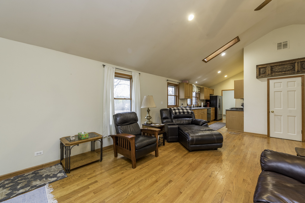 35861 North Fuller Road Gurnee, IL 60031 - Photo 3 of 30 a living room with furniture and a wooden floor
