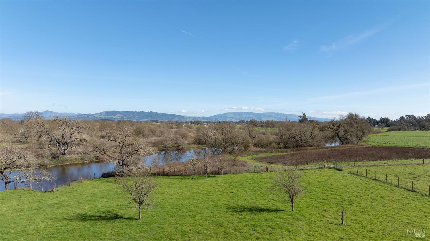 1853 Cooper Road Sebastopol, CA 95472 - Photo 4 of 8 a view of lake with mountain in the background