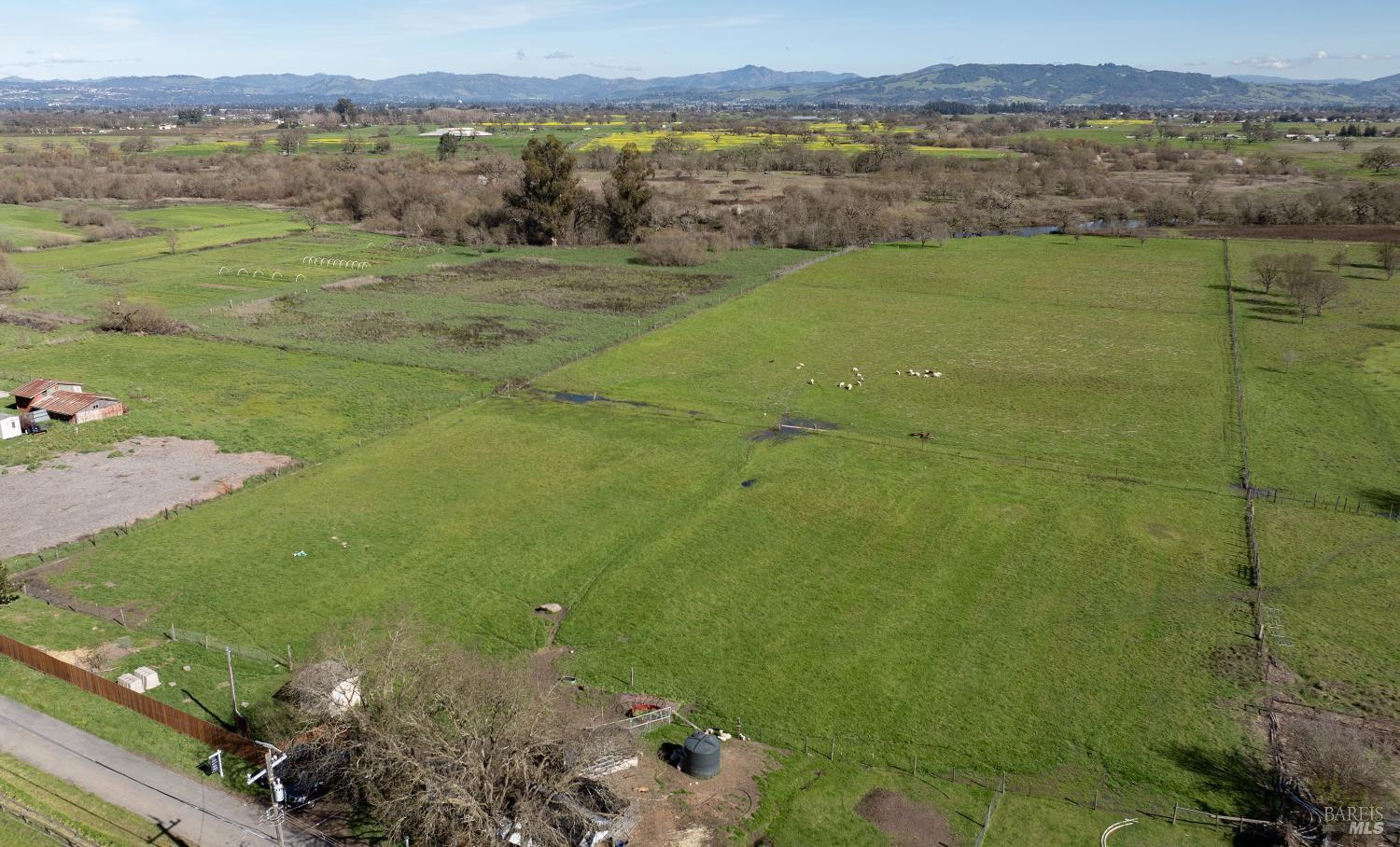 1853 Cooper Road Sebastopol, CA 95472 - Photo 7 of 8 a view of a lake with a yard