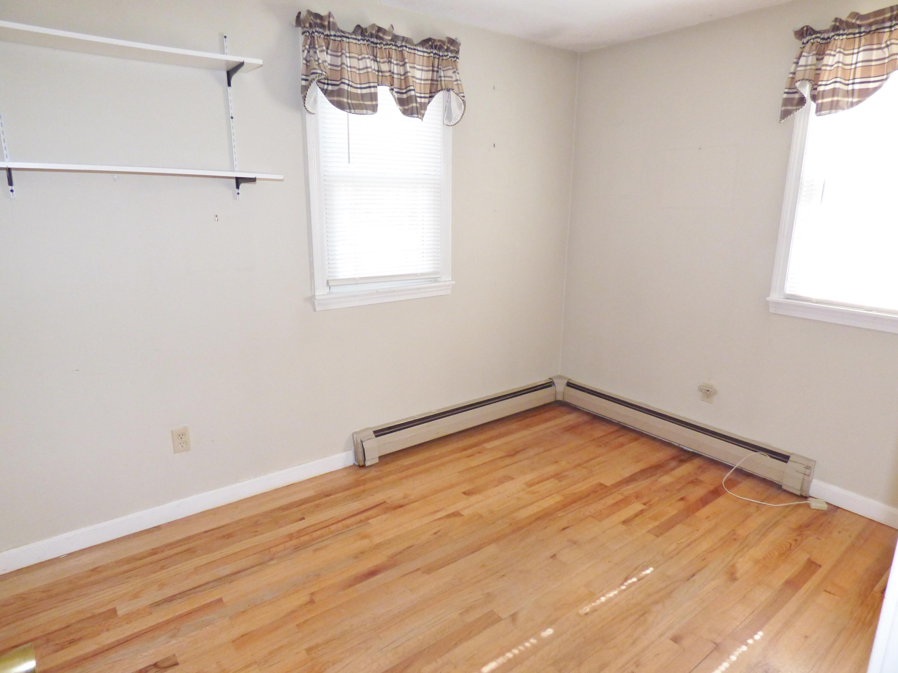 33 Lakeview Drive Sandwich, MA 02563 - Photo 11 of 32 a view of a room with wooden floor and cabinet