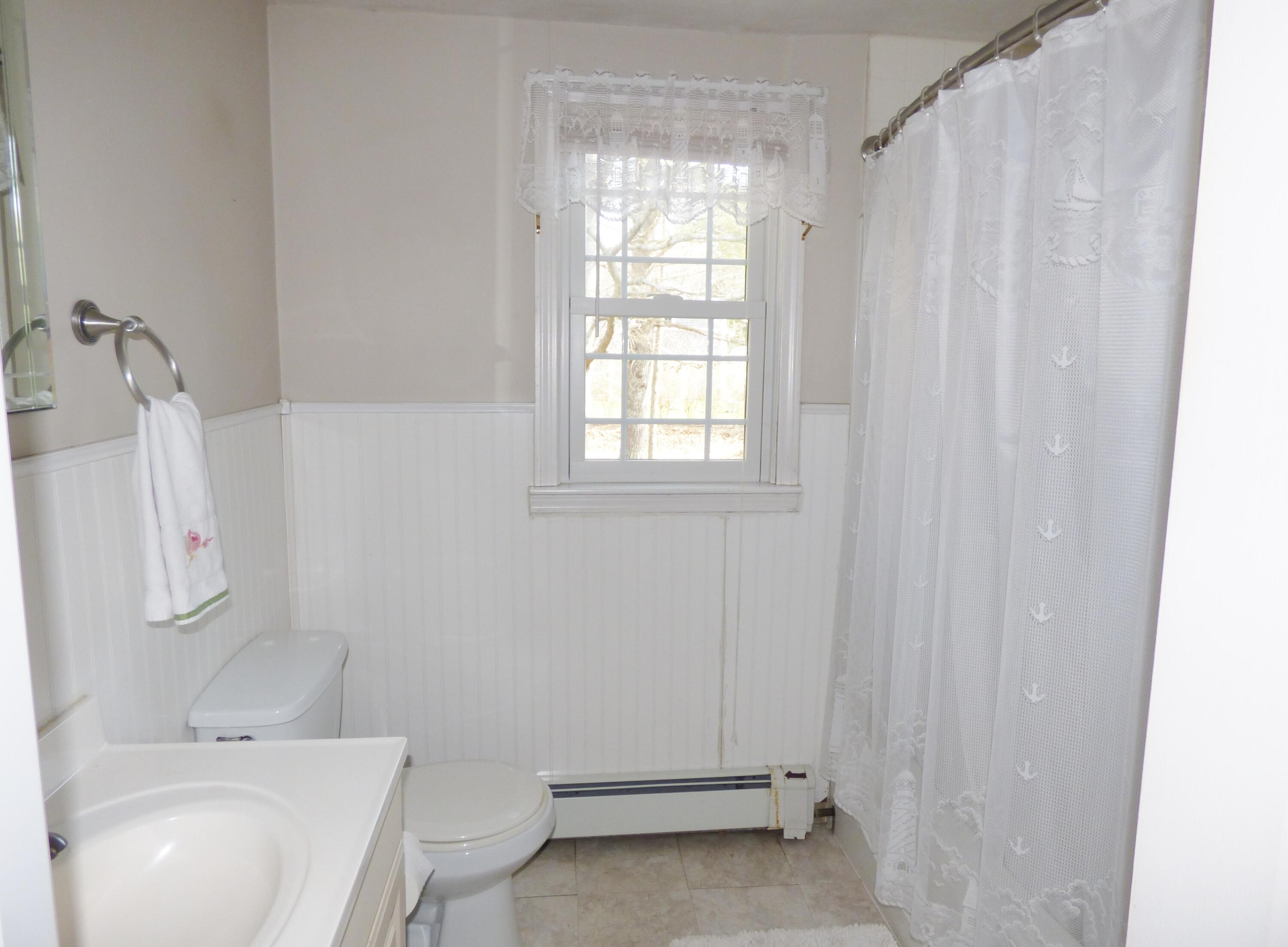 33 Lakeview Drive Sandwich, MA 02563 - Photo 17 of 32 a bathroom with a sink toilet and shower