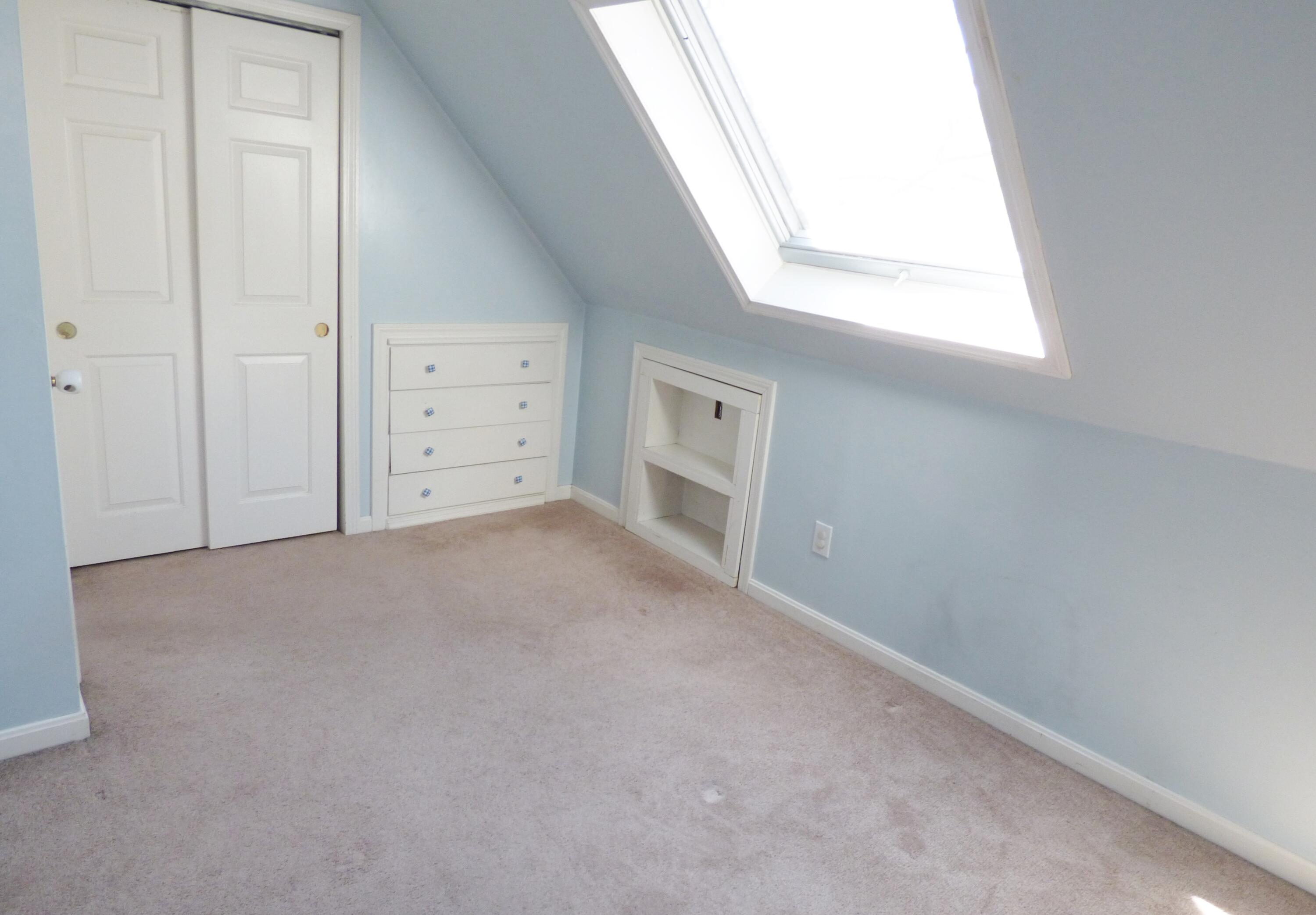 33 Lakeview Drive Sandwich, MA 02563 - Photo 19 of 32 an empty room with a window and fireplace