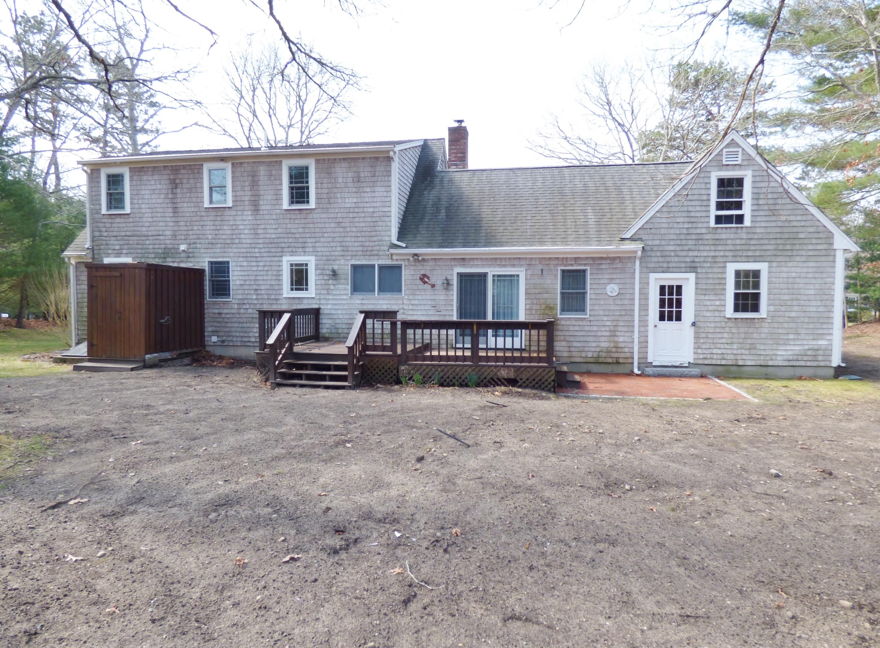 33 Lakeview Drive Sandwich, MA 02563 - Photo 24 of 32 a view of a house with a yard and roof