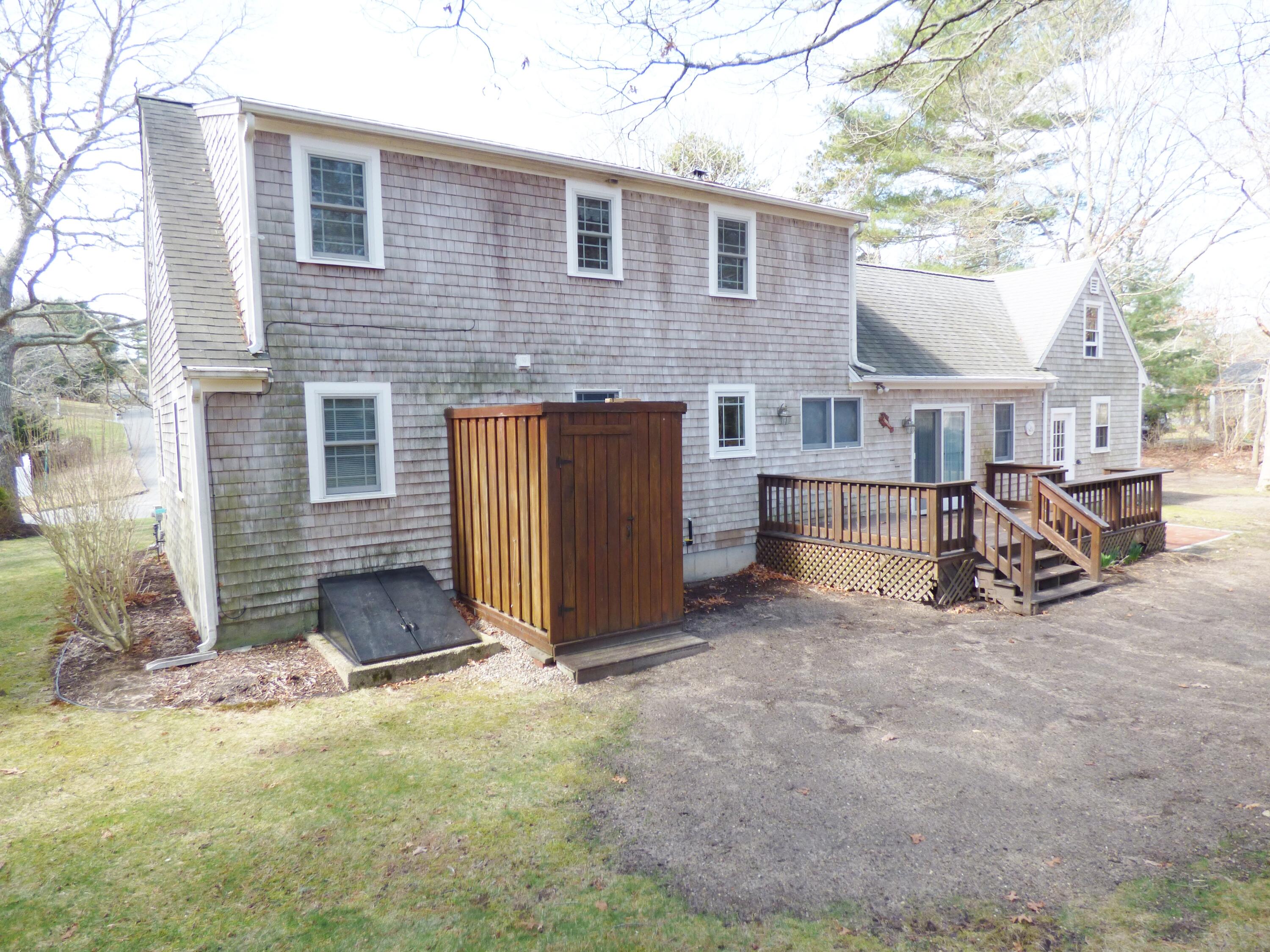 33 Lakeview Drive Sandwich, MA 02563 - Photo 25 of 32 a view of a house with a yard and sitting area