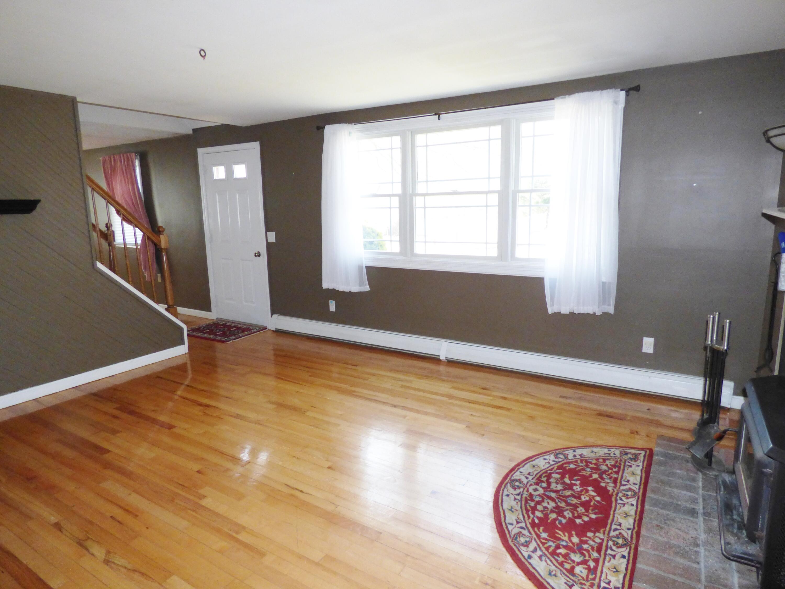 33 Lakeview Drive Sandwich, MA 02563 - Photo 4 of 32 a view of an empty room with window and wooden floor