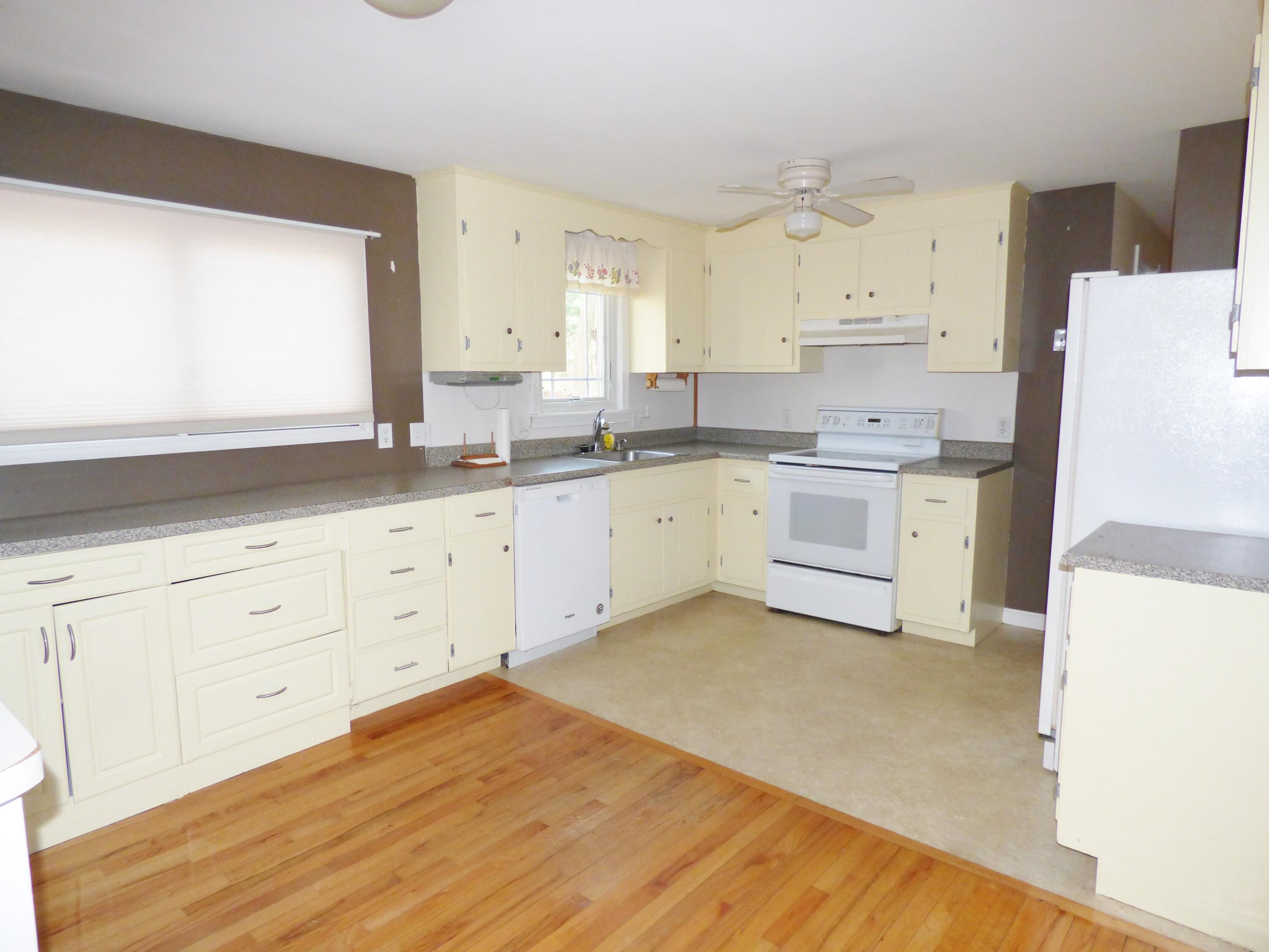 33 Lakeview Drive Sandwich, MA 02563 - Photo 6 of 32 a kitchen with a sink a stove and cabinets