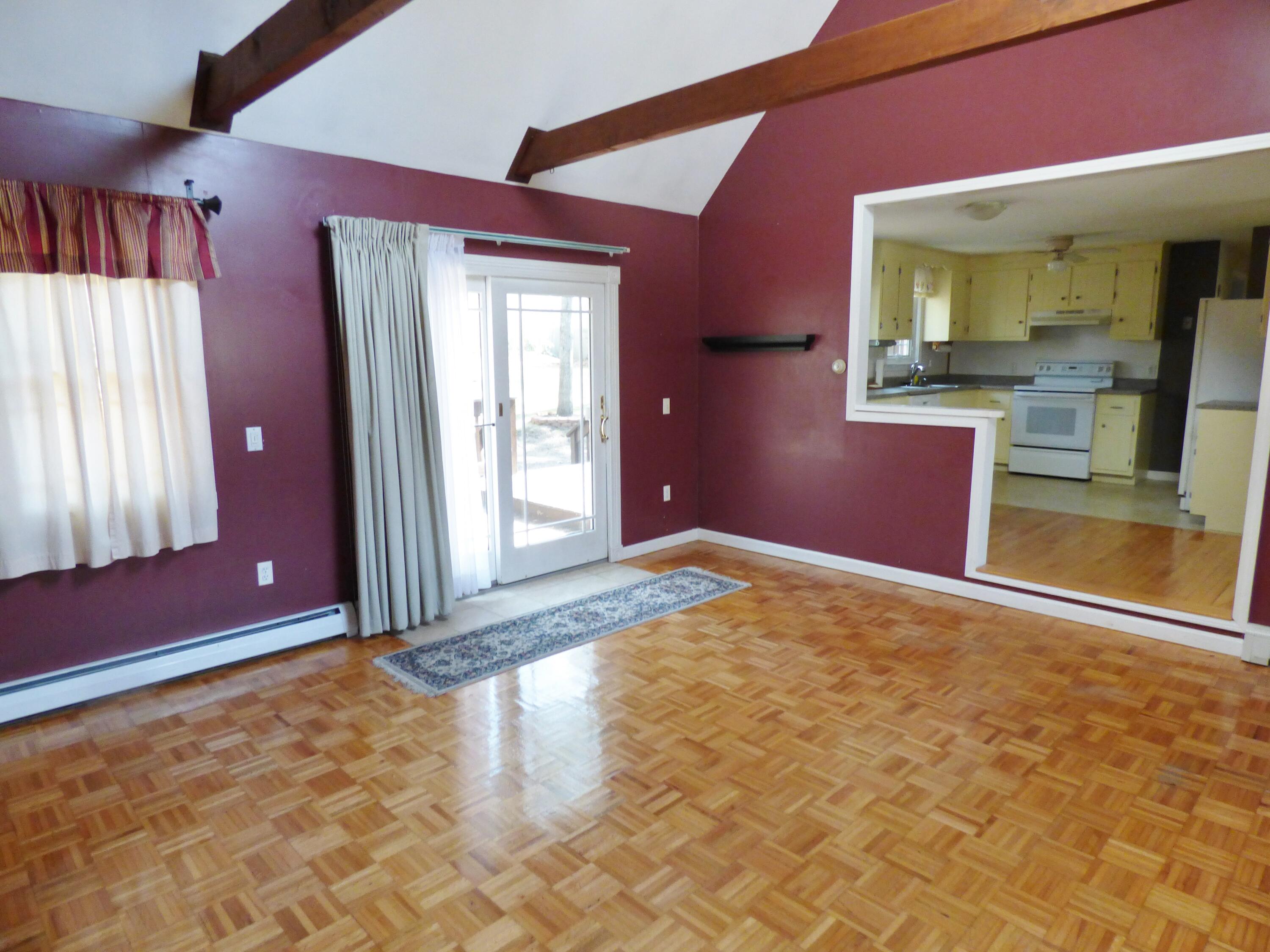 33 Lakeview Drive Sandwich, MA 02563 - Photo 9 of 32 a view of a livingroom with wooden floor and a large window