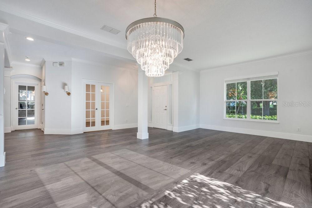 8399 Bowden Way Windermere, FL 34786 - Photo 16 of 59 a view of empty room with wooden floor and window