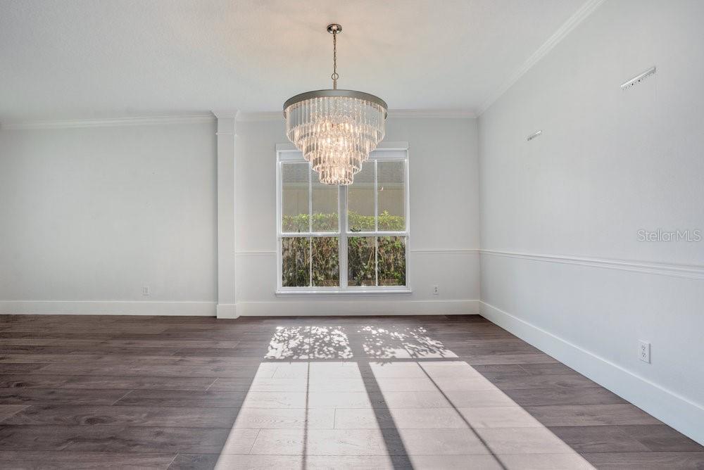 8399 Bowden Way Windermere, FL 34786 - Photo 17 of 59 a view of empty room with wooden floor and fan