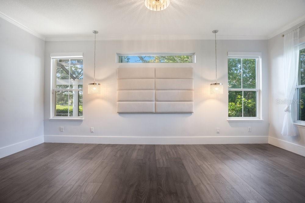 8399 Bowden Way Windermere, FL 34786 - Photo 20 of 59 an empty room with wooden floor and windows