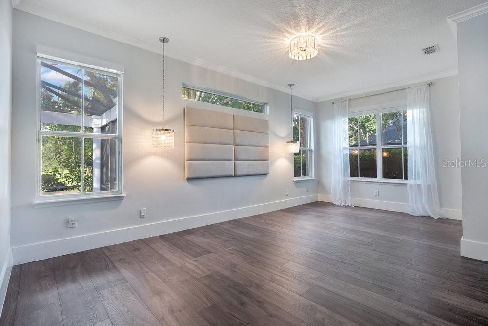 8399 Bowden Way Windermere, FL 34786 - Photo 21 of 59 a view of empty room with wooden floor and fan