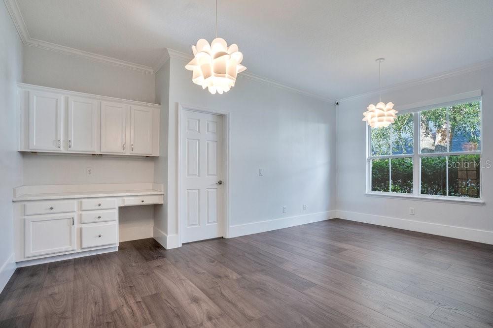 8399 Bowden Way Windermere, FL 34786 - Photo 27 of 59 an empty room with wooden floor and windows