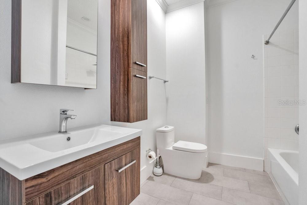 8399 Bowden Way Windermere, FL 34786 - Photo 28 of 59 a bathroom with a sink toilet and vanity