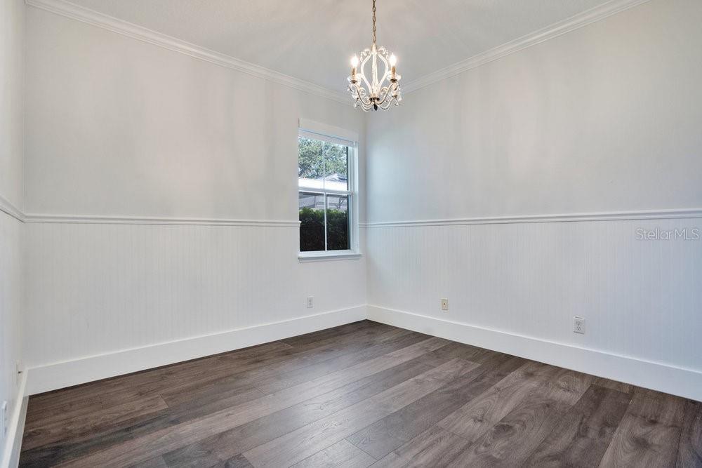 8399 Bowden Way Windermere, FL 34786 - Photo 30 of 59 wooden floor in an empty room with a window