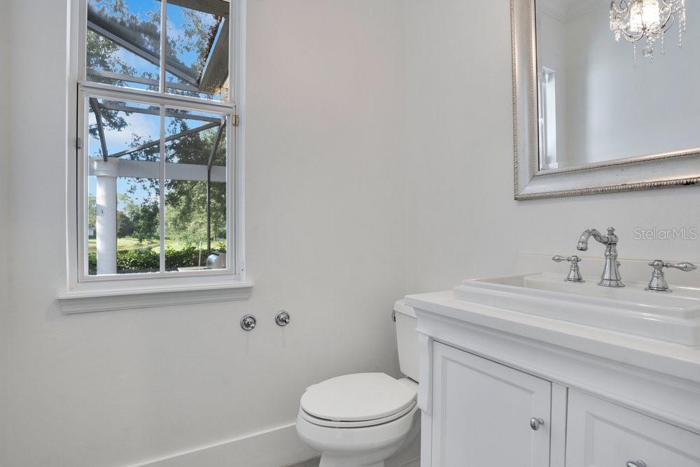 8399 Bowden Way Windermere, FL 34786 - Photo 32 of 59 a bathroom with a sink a toilet and a window