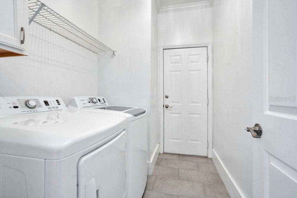 8399 Bowden Way Windermere, FL 34786 - Photo 34 of 59 a utility room with dryer and washer