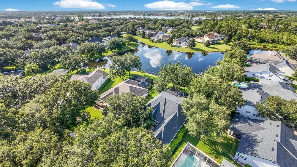 8399 Bowden Way Windermere, FL 34786 - Photo 41 of 59 an aerial view of lake residential house with swimming pool and outdoor space