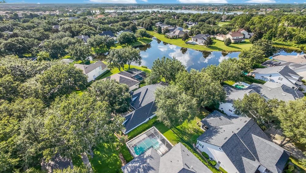 8399 Bowden Way Windermere, FL 34786 - Photo 42 of 59 an aerial view of residential houses with outdoor space and trees