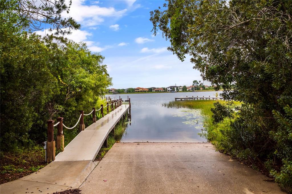 8399 Bowden Way Windermere, FL 34786 - Photo 59 of 59 a view of a lake with a garden