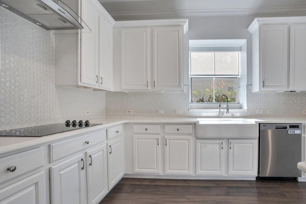 8399 Bowden Way Windermere, FL 34786 - Photo 7 of 59 a kitchen with white cabinets and a window